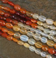 Feueropal - Oval - facettiert - 6-7mm - Kettenstrang